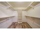 Spacious walk-in closet with shelving and hanging rods at 8303 E Monterey Ave, Mesa, AZ 85209