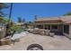 Backyard featuring a stone patio, outdoor kitchen, fire pit, and a pool at 9412 S Palm Dr, Tempe, AZ 85284