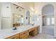 Bright bathroom with double sinks and a large mirror, offering a shared space for morning routines at 9412 S Palm Dr, Tempe, AZ 85284