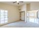 Inviting bedroom boasts a ceiling fan, closet, and patio access to enjoy outdoor living at 9412 S Palm Dr, Tempe, AZ 85284