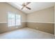 Carpeted bedroom with bright window and neutral tones is move-in ready at 9412 S Palm Dr, Tempe, AZ 85284