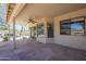 Relaxing covered patio offers views of the pool with a rock waterfall, blending indoor and outdoor living at 9412 S Palm Dr, Tempe, AZ 85284