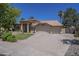 Spacious three car garage home with a tile roof and meticulously kept landscaping at 9412 S Palm Dr, Tempe, AZ 85284