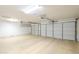 Spacious two car garage with epoxy floors and overhead storage at 9412 S Palm Dr, Tempe, AZ 85284