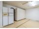 Garage area with cabinets and additional refrigerator for extra storage at 9412 S Palm Dr, Tempe, AZ 85284