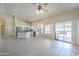 Spacious kitchen features white cabinets, stainless appliances, and a large island with tile floors and bright light at 9412 S Palm Dr, Tempe, AZ 85284