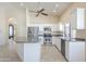 Bright kitchen with white cabinets, stainless appliances, and island at 9412 S Palm Dr, Tempe, AZ 85284