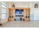 Inviting living room featuring a custom entertainment center and bright, neutral decor at 9412 S Palm Dr, Tempe, AZ 85284
