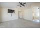 Main bedroom featuring carpet, natural light, and wall-mounted television at 9412 S Palm Dr, Tempe, AZ 85284