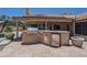 Covered outdoor kitchen with stainless steel appliances and counter space at 9412 S Palm Dr, Tempe, AZ 85284
