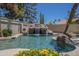 Gorgeous outdoor pool area featuring a rock waterfall and lush landscaping with cactus at 9412 S Palm Dr, Tempe, AZ 85284