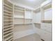 Large walk-in closet with ample shelving and drawers, providing plenty of storage space at 9412 S Palm Dr, Tempe, AZ 85284