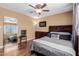 Inviting bedroom with a decorative mirror and a large window with blinds at 1133 N 84Th Pl, Scottsdale, AZ 85257