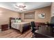 Bright bedroom features a ceiling fan, work space and natural light at 1133 N 84Th Pl, Scottsdale, AZ 85257