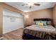 Comfortable bedroom featuring wood floors, closet and a cozy, inviting atmosphere at 1133 N 84Th Pl, Scottsdale, AZ 85257