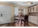 Cozy dining area with a round table and natural light from the sliding glass door at 1133 N 84Th Pl, Scottsdale, AZ 85257