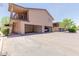 Building exterior featuring staircase access, a garage and well-maintained landscaping at 1133 N 84Th Pl, Scottsdale, AZ 85257