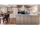 Well-lit kitchen featuring stainless steel appliances and a breakfast bar at 1133 N 84Th Pl, Scottsdale, AZ 85257