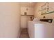 Functional laundry room with commercial grade washing machines and helpful laundry instructions at 1133 N 84Th Pl, Scottsdale, AZ 85257