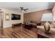 Spacious living room with comfortable seating and a mounted TV at 1133 N 84Th Pl, Scottsdale, AZ 85257