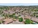 An aerial perspective of a neighborhood with lush green trees and well-maintained residential properties at 1145 E Winchester Pl, Chandler, AZ 85286