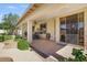 Spacious covered back patio featuring ceiling fans, neutral colors, and an outdoor dining area at 1145 E Winchester Pl, Chandler, AZ 85286