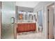 Bathroom boasting double sinks, a granite countertop, a walk-in shower, and a separate toilet room at 1145 E Winchester Pl, Chandler, AZ 85286