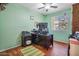 Home office space with hardwood floors, a window, and a desk at 1145 E Winchester Pl, Chandler, AZ 85286