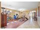 Versatile bonus room furnished with exercise equipment, featuring wood-look floors and ample natural light at 1145 E Winchester Pl, Chandler, AZ 85286