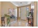 Welcoming foyer with neutral tones, tile flooring, and decorative shelving for a modern touch at 1145 E Winchester Pl, Chandler, AZ 85286