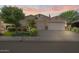 Charming single-story home with a well-manicured lawn, mature trees and a three car garage at 1145 E Winchester Pl, Chandler, AZ 85286