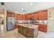 Modern kitchen with granite island, stainless steel appliances and custom tile backsplash at 1145 E Winchester Pl, Chandler, AZ 85286