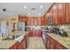 Beautiful kitchen with granite counters, spacious island, stainless appliances and custom cabinets at 1145 E Winchester Pl, Chandler, AZ 85286