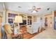 Inviting living room with hardwood floors, ceiling fan and open floor plan to kitchen at 1145 E Winchester Pl, Chandler, AZ 85286