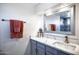 Updated bathroom features marble countertops, bronze fixtures, and modern decorative elements at 1211 N Miller Rd # 257, Scottsdale, AZ 85257