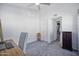 This carpeted bedroom features white walls and an ensuite bathroom entrance at 1211 N Miller Rd # 257, Scottsdale, AZ 85257