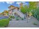 Charming multi-level condo with stucco siding, red tile roof, and well maintained desert landscaping at 1211 N Miller Rd # 257, Scottsdale, AZ 85257