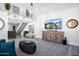 Open living room with vaulted ceiling, natural light, modern furnishings, and seamless transitions to other spaces at 1211 N Miller Rd # 257, Scottsdale, AZ 85257