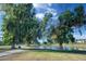 Exterior shot of park with mature trees, walking paths, pond, grassy areas, and building in the background at 1211 N Miller Rd # 257, Scottsdale, AZ 85257