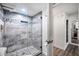 Stylish shower with glass enclosure, mosaic tile accents, and modern fixtures creating a spa-like experience at 1211 N Miller Rd # 257, Scottsdale, AZ 85257