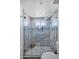 Elegant walk-in shower features mosaic tile and a glass enclosure at 1211 N Miller Rd # 257, Scottsdale, AZ 85257