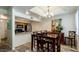 Dining area leading into kitchen with stainless steel appliances and granite countertops at 1222 W Baseline Rd # 163, Tempe, AZ 85283