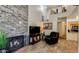 Open concept living room with fireplace, and views to kitchen and second floor loft at 1222 W Baseline Rd # 163, Tempe, AZ 85283