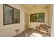 Outdoor patio with seating area and an enclosed screen door entrance at 1222 W Baseline Rd # 163, Tempe, AZ 85283