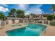Community pool with clear blue water, sun loungers, and a hot tub at 1222 W Baseline Rd # 163, Tempe, AZ 85283