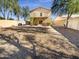Large backyard, surrounded by a privacy fence, offering a blank canvas for your landscaping vision at 13106 W Calavar Rd, Surprise, AZ 85379