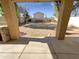 View of the private backyard with stone covering at 13106 W Calavar Rd, Surprise, AZ 85379