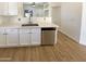 Updated kitchen featuring stainless steel appliances, new quartz countertops, and stylish cabinetry at 13106 W Calavar Rd, Surprise, AZ 85379