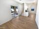 Open-concept living area with a staircase and sliding doors leading to the backyard at 13106 W Calavar Rd, Surprise, AZ 85379