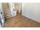 View of a living room featuring stairs and a kitchen area at 13106 W Calavar Rd, Surprise, AZ 85379